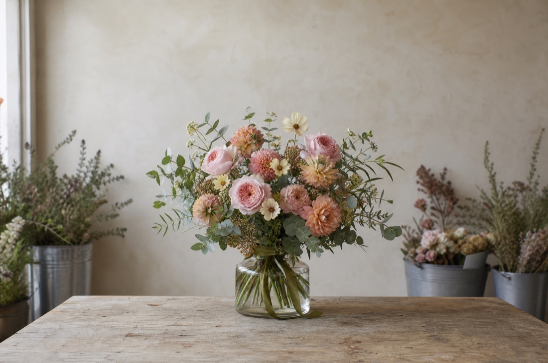 A loose bouquet of pastel seasonal flowers